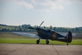 RAF fighter aircraft from the Battle of Britain era parked at an airfield Royalty Free Stock Photo