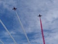 RAF Red Arrows in action with coloured smoke Royalty Free Stock Photo