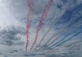 RAF Red Arrows in action with coloured smoke Royalty Free Stock Photo