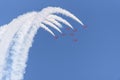 RAF Red Arrows display team inverted at the top of a loop at an air show Royalty Free Stock Photo