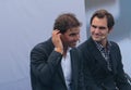 Rafa Nadal and Roger Federer gesturing