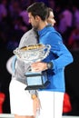 Rafael Nadal of Spain L congratulates 2019 Australian Open champion Novak Djokovic with victory during trophy presentation