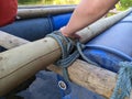 Raft building team work logs roped tied together