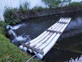 Raft for salvaging fallen leaves in pond, Boat. Royalty Free Stock Photo