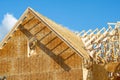 rafters and walls of new plywood house wooden framework Royalty Free Stock Photo