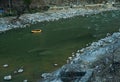 Rafting : boat moving on quiet river section-river Beas . next to Kullu town in Himachal Pradesh