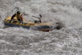 Rafting, brave and courageous people conquer water obstacles on a mountain river on rafts, along the river, in the spring.