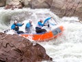 Rafting, brave and courageous people conquer water obstacles on a mountain river on rafts, along the river, in the spring.