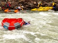 Rafting, brave and courageous people conquer water obstacles on a mountain river on rafts, along the river, in the spring.