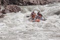 Rafting, brave and courageous people conquer water obstacles on a mountain river on rafts.