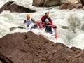 Rafting, brave and courageous people conquer water obstacles on a mountain river on rafts.