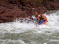 Rafting, brave and courageous people conquer water obstacles on a mountain river on rafts.