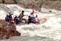 Rafting, brave and courageous people conquer water obstacles on a mountain river on rafts..