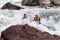 Rafting the brave and courageous people who are traveling on a mountain river in a rushing torrent of water.