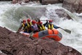 Rafting the brave and courageous people who are traveling on a mountain river in a rushing torrent of water.