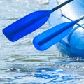Rafting. Close-up of oars and part of a rubber inflatable boat on the water Royalty Free Stock Photo