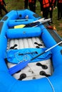 Rafting inflatable blue boat wit rafters on side