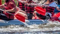 Rafting, kayaking. Extreme sport. Water ecological tourism. Close-up view of oars with splashing water.