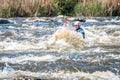 Rafting, kayaking. An unidentified man are sailing on his short Dagger whitewater kayak. Ecological water tourism.