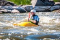 Rafting, kayaking. An unidentified man are sailing on his short Dagger whitewater kayak. Ecological water tourism.