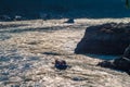 Rafting on the powerful Ganges river in the sun glares in Rishikesh, North India. Royalty Free Stock Photo