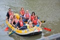 Rafting , Smiling happy people on a rubber-boat rafting on calm waters