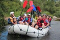 Rafting team , summer extreme water sport . Group of adventurer doing white water rafting