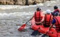 Rafting team , summer extreme water sport. Group of people in a rafting boat, beautiful adrenaline ride down the River.