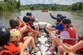 Rafting team , summer extreme water sport. Group of people in a rafting boat, beautiful adrenaline ride down the River.