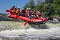 Rafting team , summer extreme water sport. Group of people in a rafting boat, beautiful