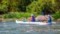 Rafting. Two girls descend on a large inflatable kayak on the river