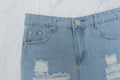 Ragged denim shorts. Close up. Fashionable concept. Royalty Free Stock Photo