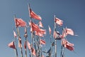 Ragged fishing marker flags against the blue sky