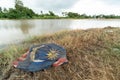 Ragged Malaysian flag on a lake coast Royalty Free Stock Photo