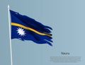Ragged national flag Nauru. Wavy torn fabric on blue background.