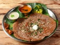 Ragi Dosa or finger millet dosa a south Indian traditional Breakfast served with chutney,sambar and potato masala topped with Royalty Free Stock Photo