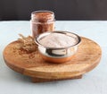 Ragi Flour in a Bowl on a Wooden Table Royalty Free Stock Photo