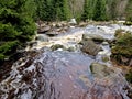 raging elements of water in a mountain river. the damaged and torn Royalty Free Stock Photo