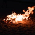 Raging fire on the beach at night