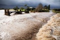 Raging flood waters of a river in flood