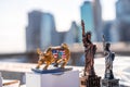 A raging golden bull and statue of liberty souvenir on the Brooklyn Bridge in New York, USA
