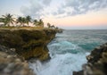 Raging ocean, rocky coast at sunset light. Caribbean travel destination