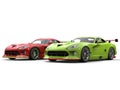 Raging red and crazy green super race cars side by side on start line
