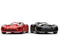 Raging red and midnight black super sports cars - side by side