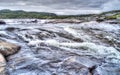 Raging river in the middle of Norwegian tundra Royalty Free Stock Photo