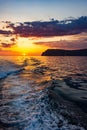 Raging sea waves at sunset in the ocean.