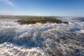 Raging storm waves smashing into rocks