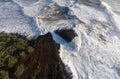 Raging storm waves smashing into rocks