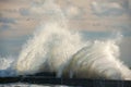 Raging waves crashing on a stone pier. Royalty Free Stock Photo