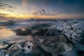 Raging waves smashing ice blocks at sunrise on Diamond Beach Royalty Free Stock Photo